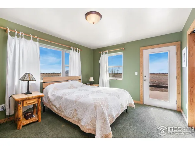 a bedroom with a bed and a view of bedroom