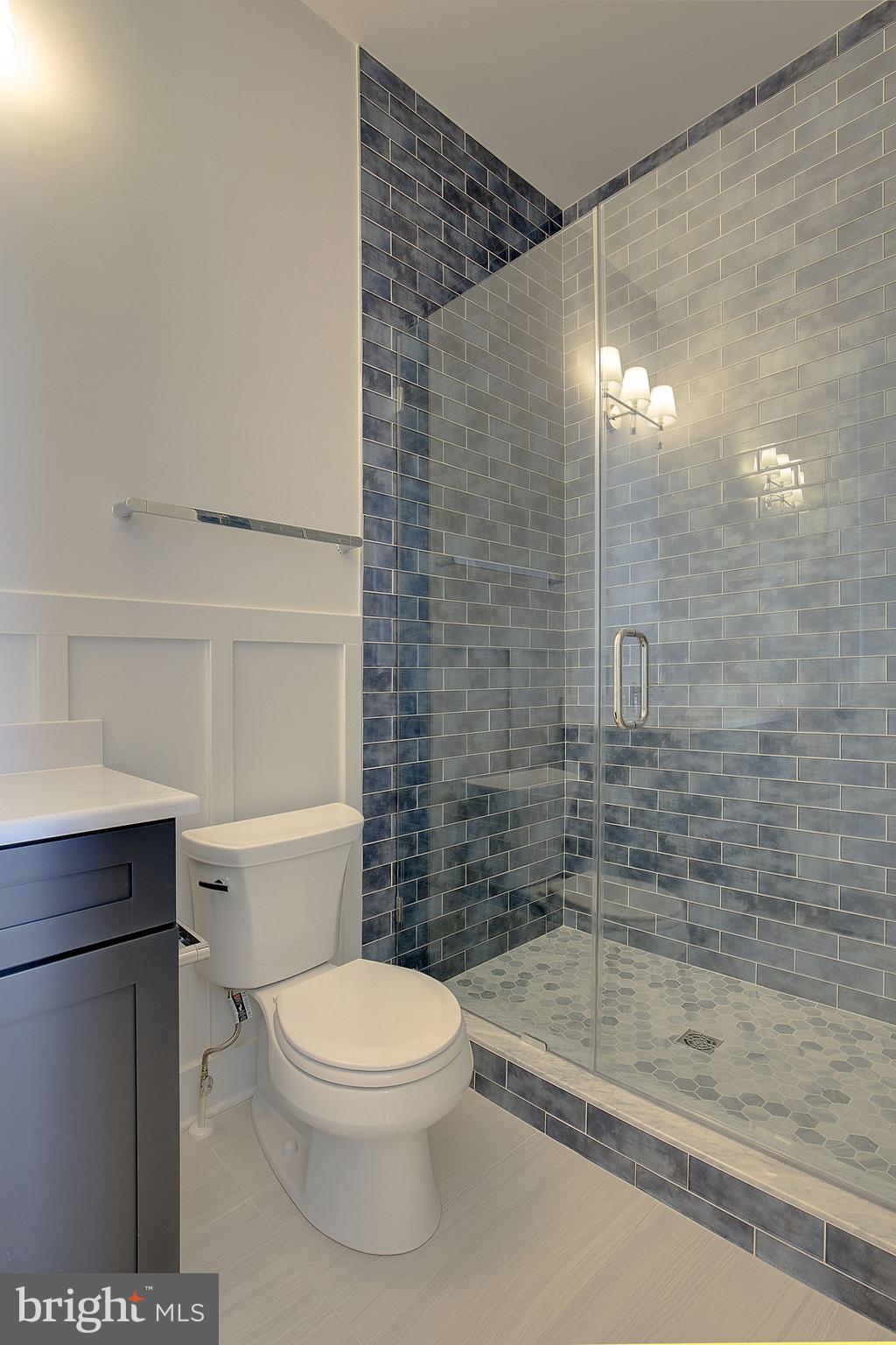 13 Elliott Road Annapolis, MD 21403 - Photo 12 of 14 a bathroom with a toilet a sink and shower