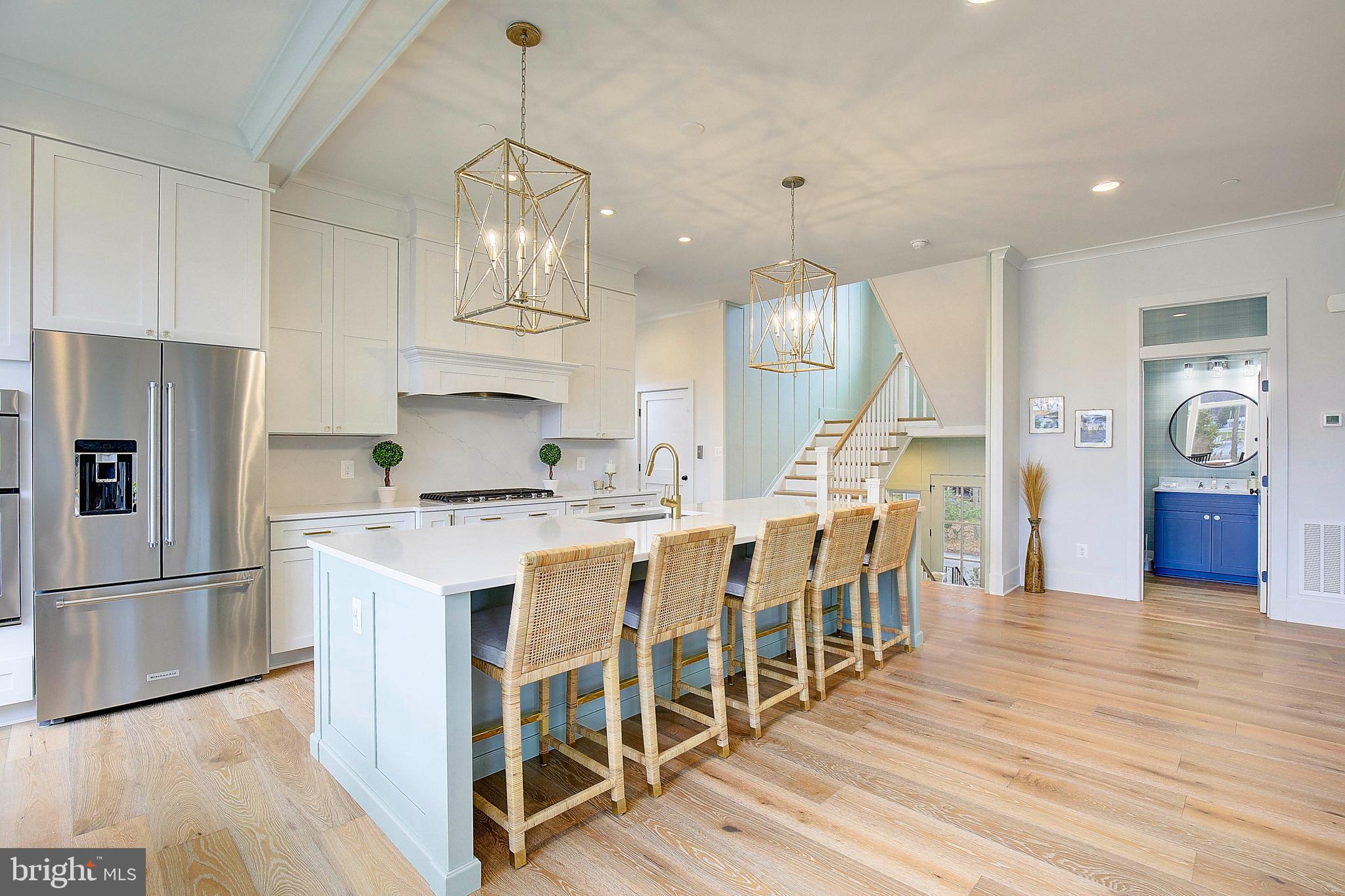 13 Elliott Road Annapolis, MD 21403 - Photo 6 of 14 a kitchen with stainless steel appliances granite countertop a refrigerator a stove and a wooden floors