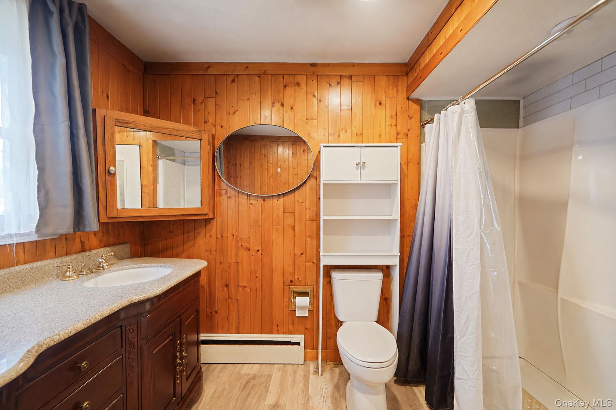 85 Applegate Drive Central Islip, NY 11722 - Photo 17 of 33 a bathroom with a sink and a mirror