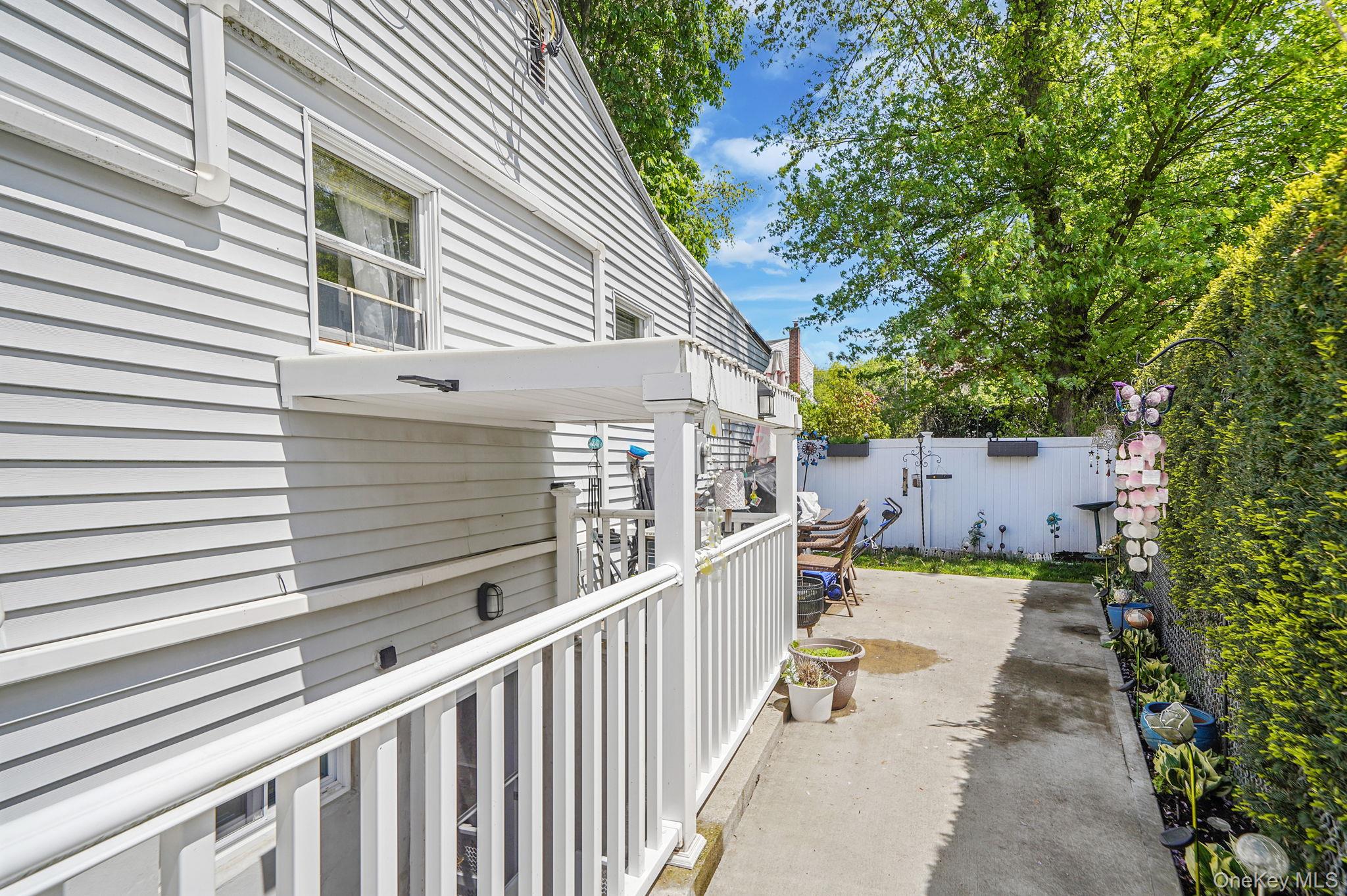 85 Applegate Drive Central Islip, NY 11722 - Photo 22 of 33 a view of a house with wooden fence