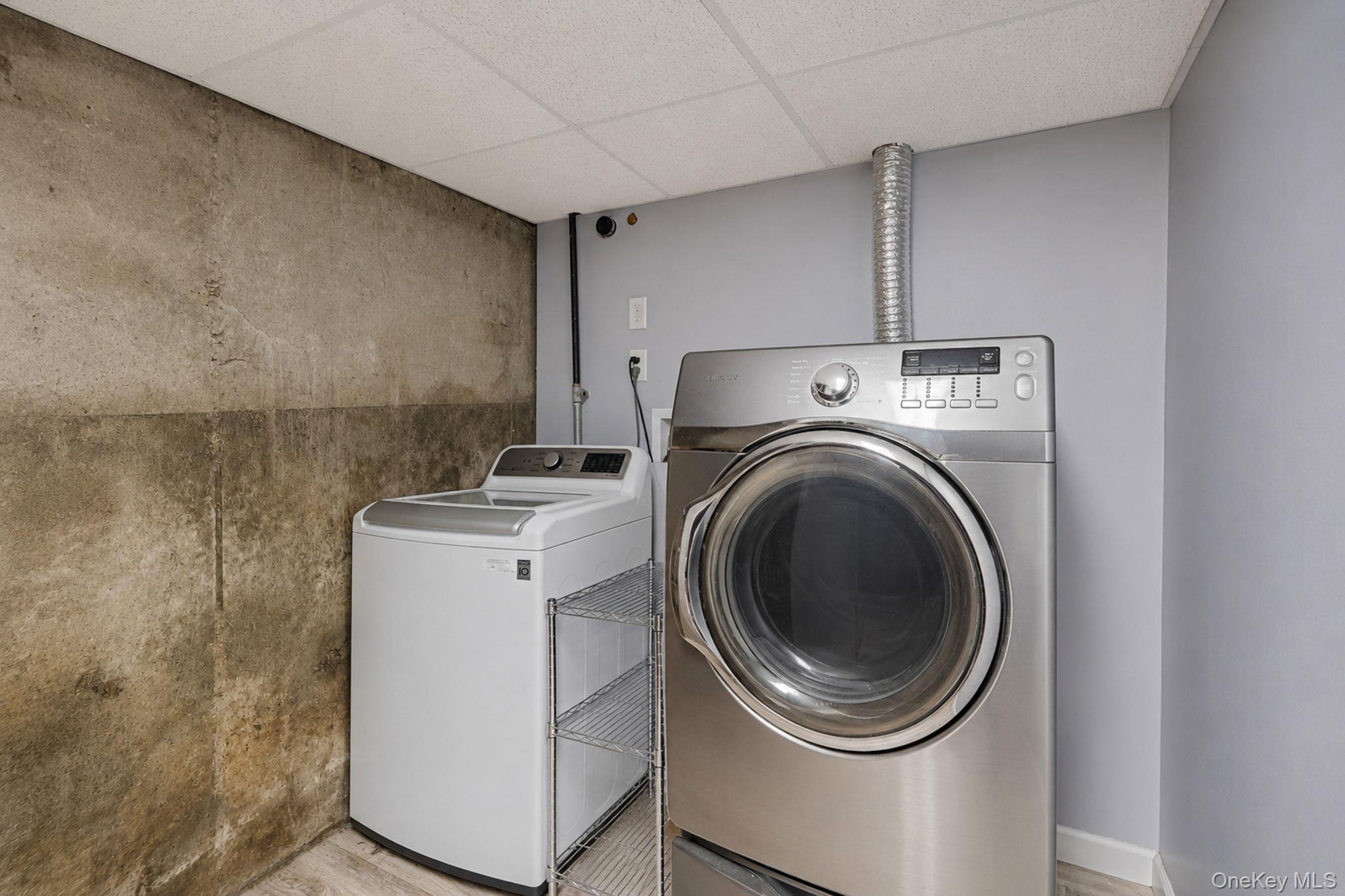 85 Applegate Drive Central Islip, NY 11722 - Photo 28 of 33 a utility room with dryer and washer