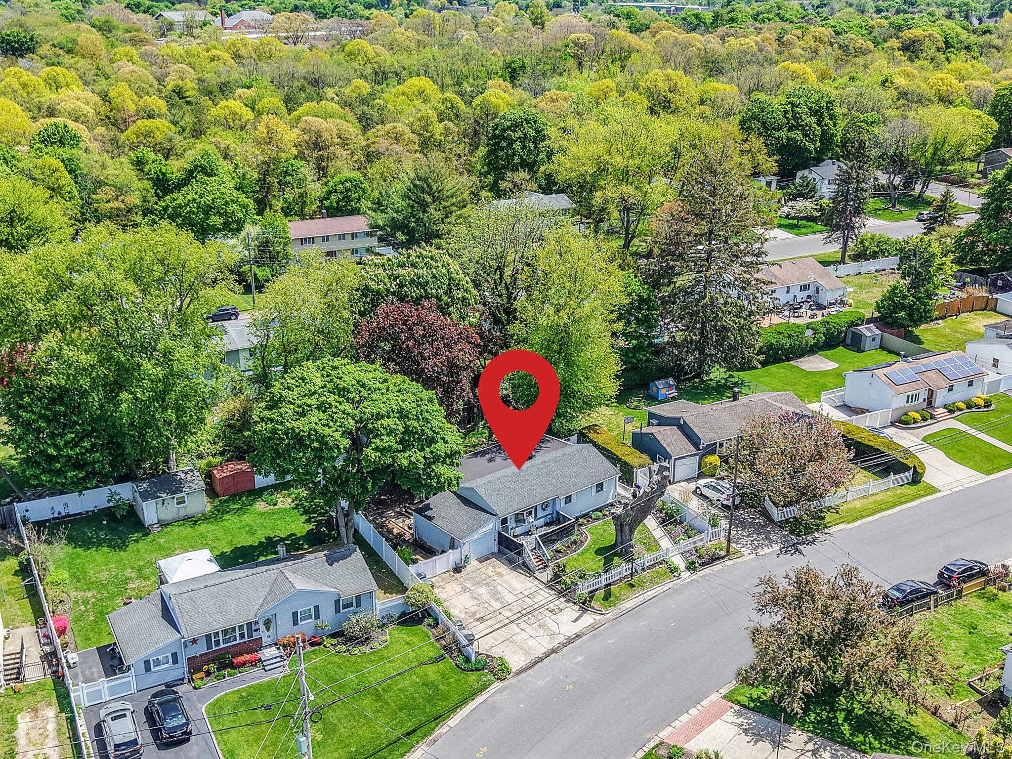 85 Applegate Drive Central Islip, NY 11722 - Photo 29 of 33 an aerial view of a house with a yard and lake view