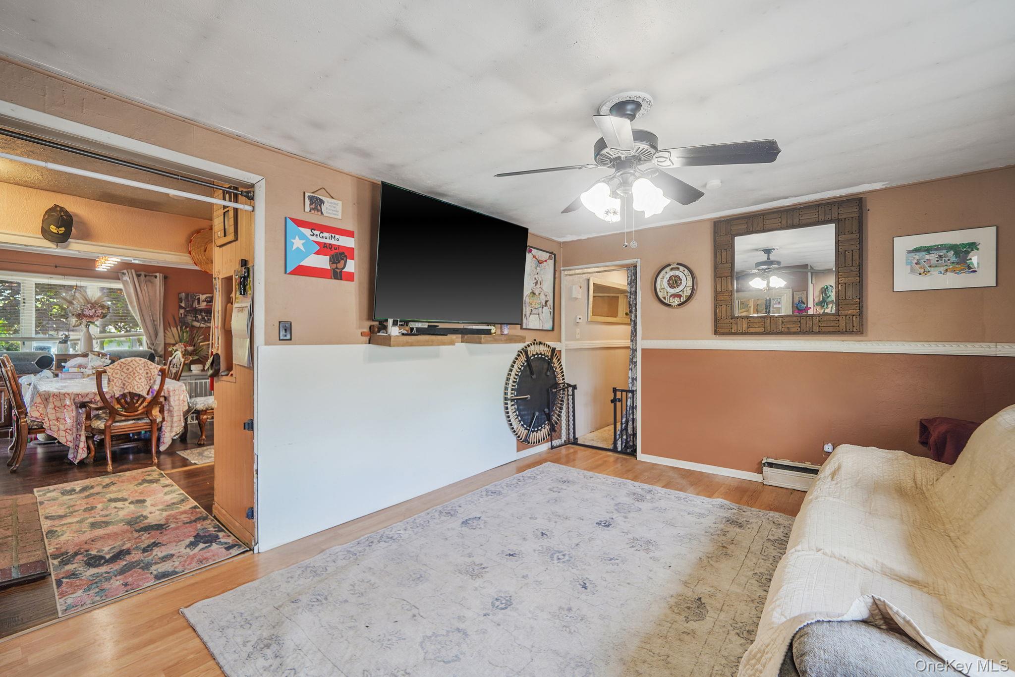 85 Applegate Drive Central Islip, NY 11722 - Photo 3 of 33 a view of a livingroom with workspace and a window