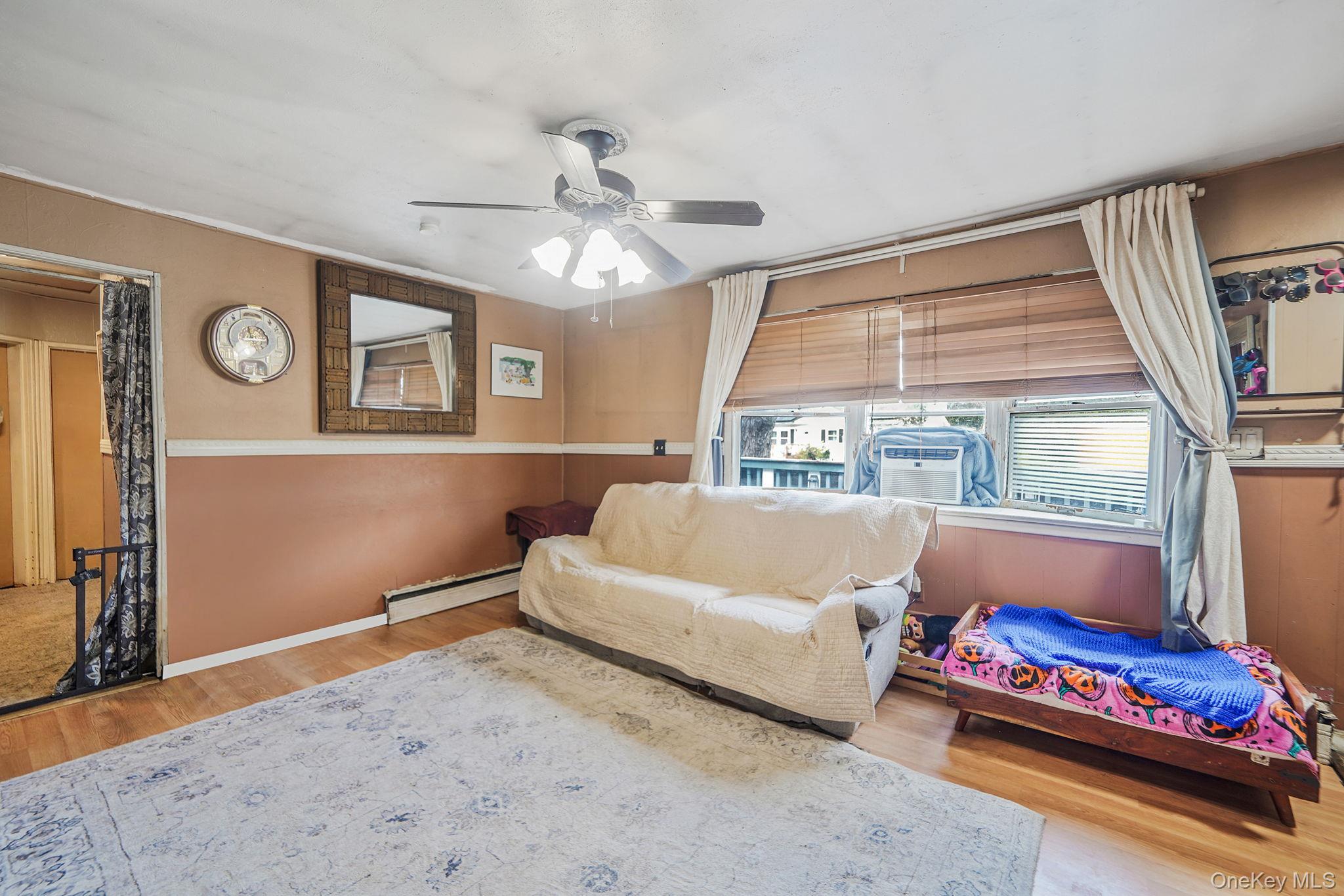 85 Applegate Drive Central Islip, NY 11722 - Photo 4 of 33 a living room with furniture and a window
