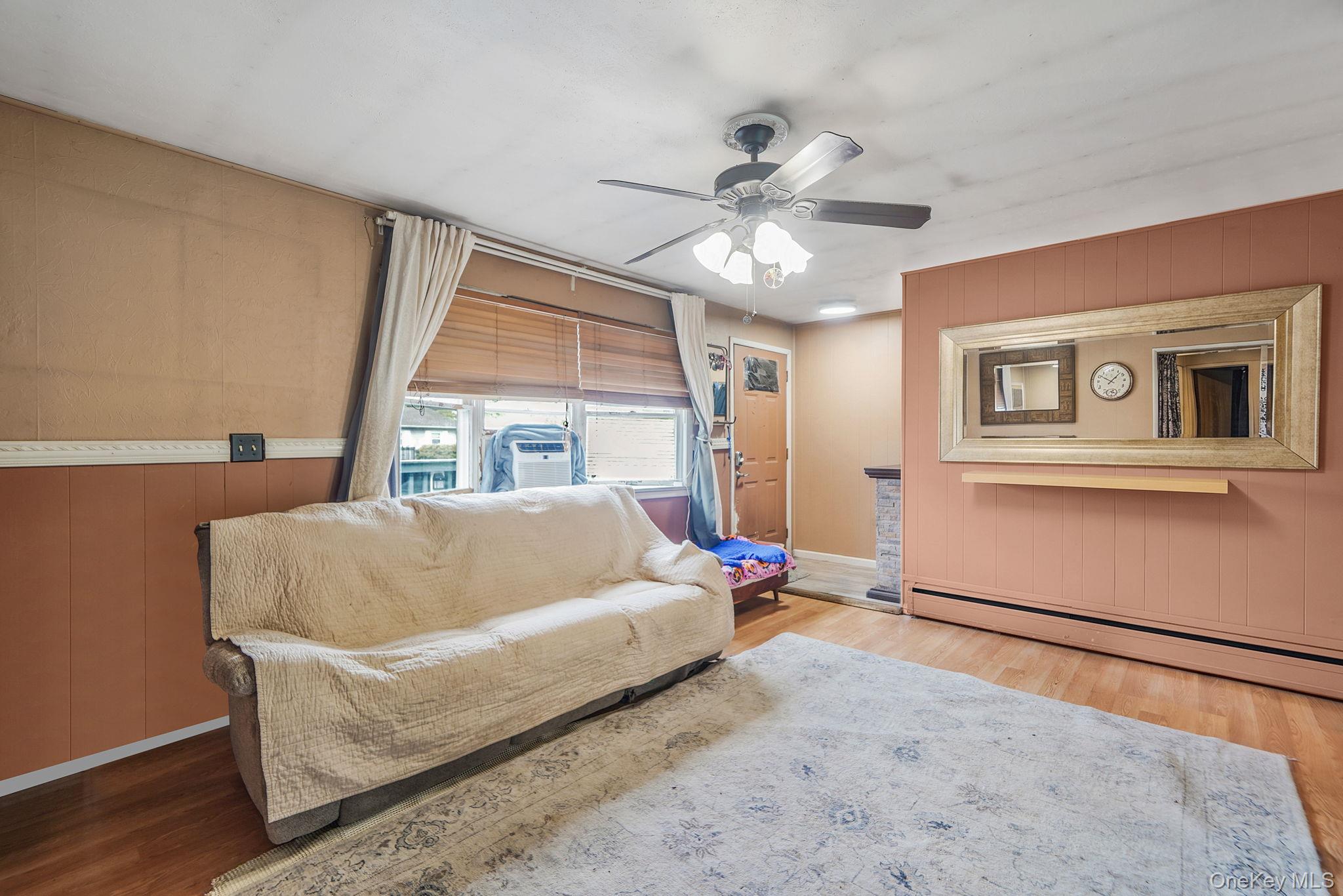 85 Applegate Drive Central Islip, NY 11722 - Photo 5 of 33 a bed sitting in a bedroom next to a window