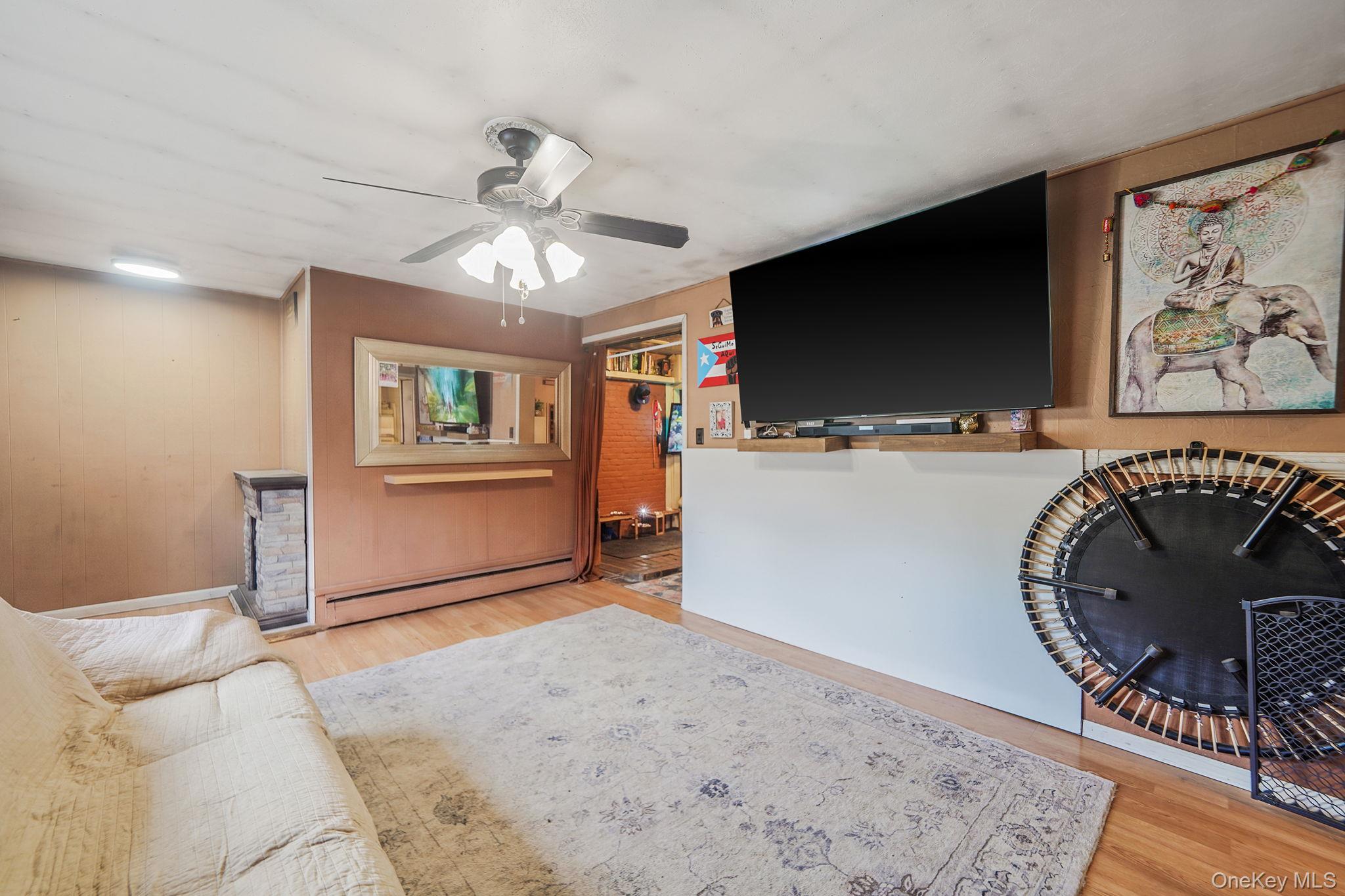 85 Applegate Drive Central Islip, NY 11722 - Photo 6 of 33 a view of a livingroom with furniture and a flat screen tv
