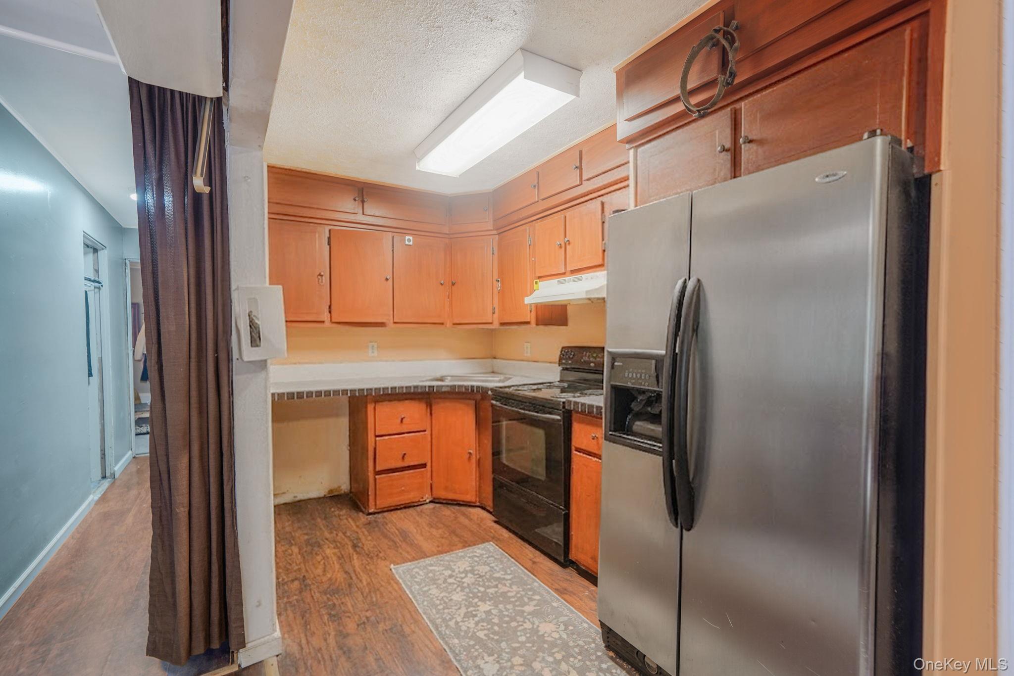 85 Applegate Drive Central Islip, NY 11722 - Photo 9 of 33 a kitchen with stainless steel appliances granite countertop a refrigerator and a stove