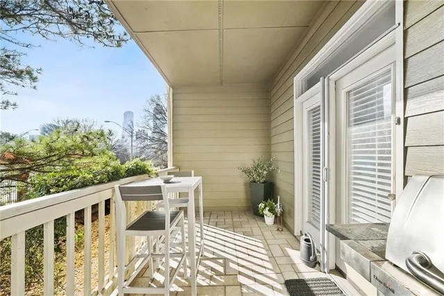 a view of a balcony with chairs