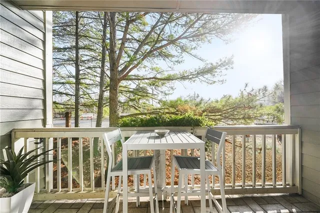 a view of a large building with a tree