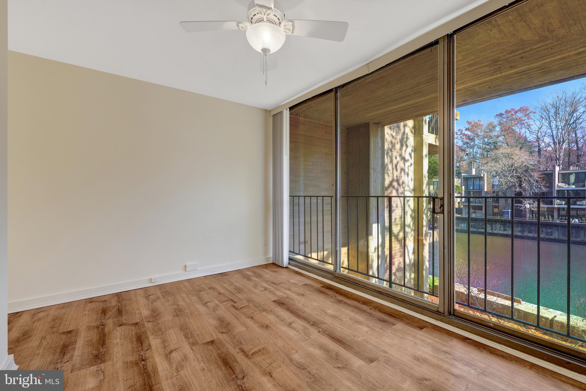 11400 Washington Plaza West, Unit 103 Reston, VA 20190 - Photo 16 of 57 a view of an empty room with a balcony