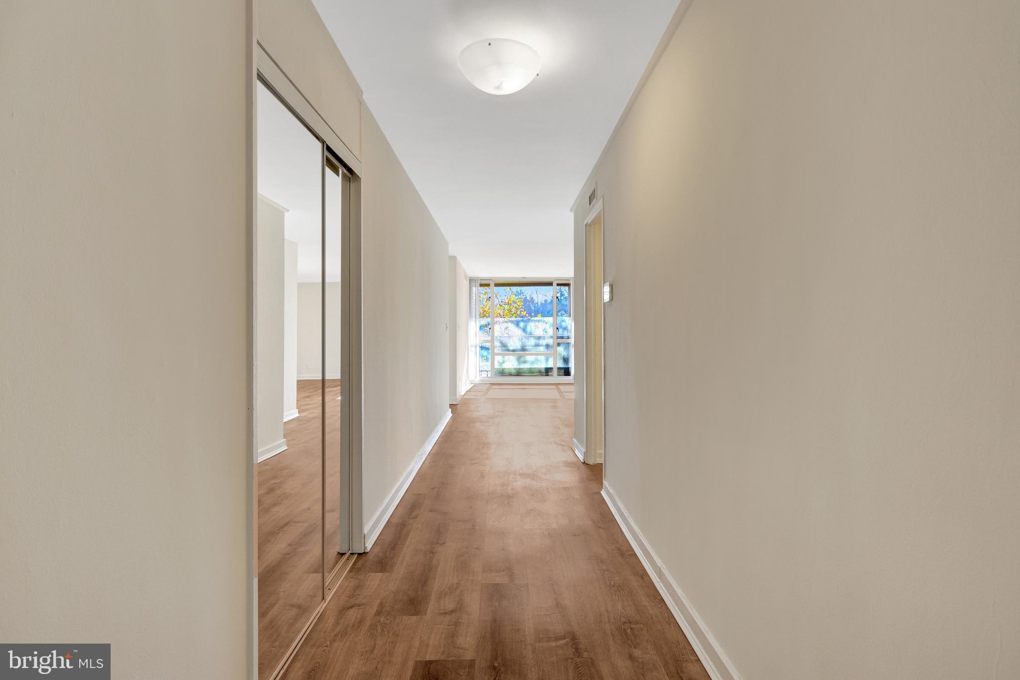 11400 Washington Plaza West, Unit 103 Reston, VA 20190 - Photo 26 of 57 a view of a hallway with wooden floor and staircase