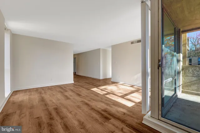 a view of balcony with wooden floor and sink