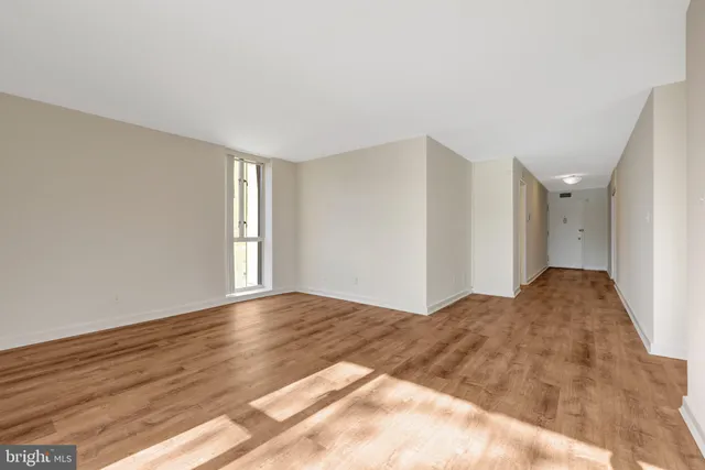 a backyard of a building with large tree