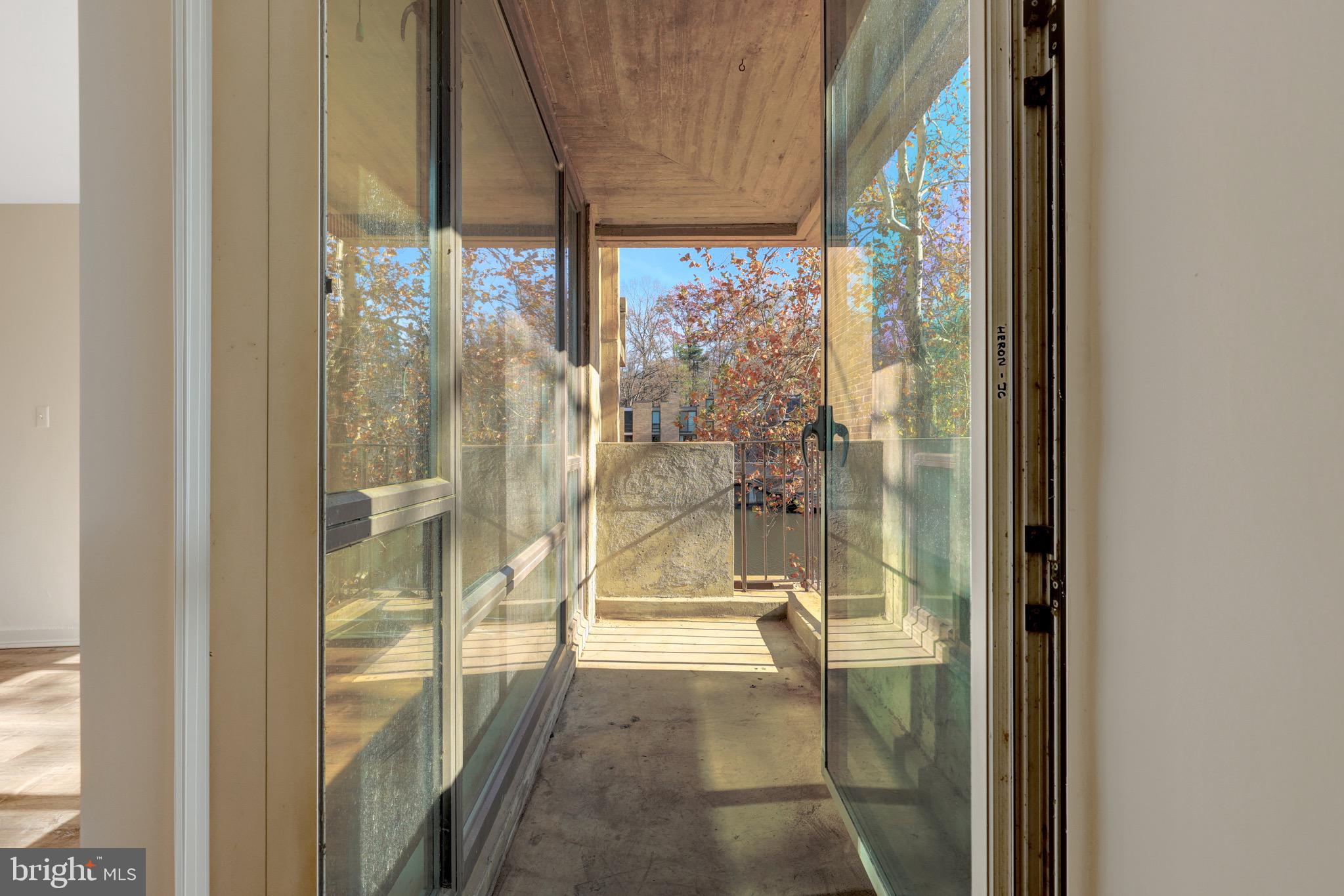 11400 Washington Plaza West, Unit 103 Reston, VA 20190 - Photo 33 of 57 a bathroom with a glass shower door