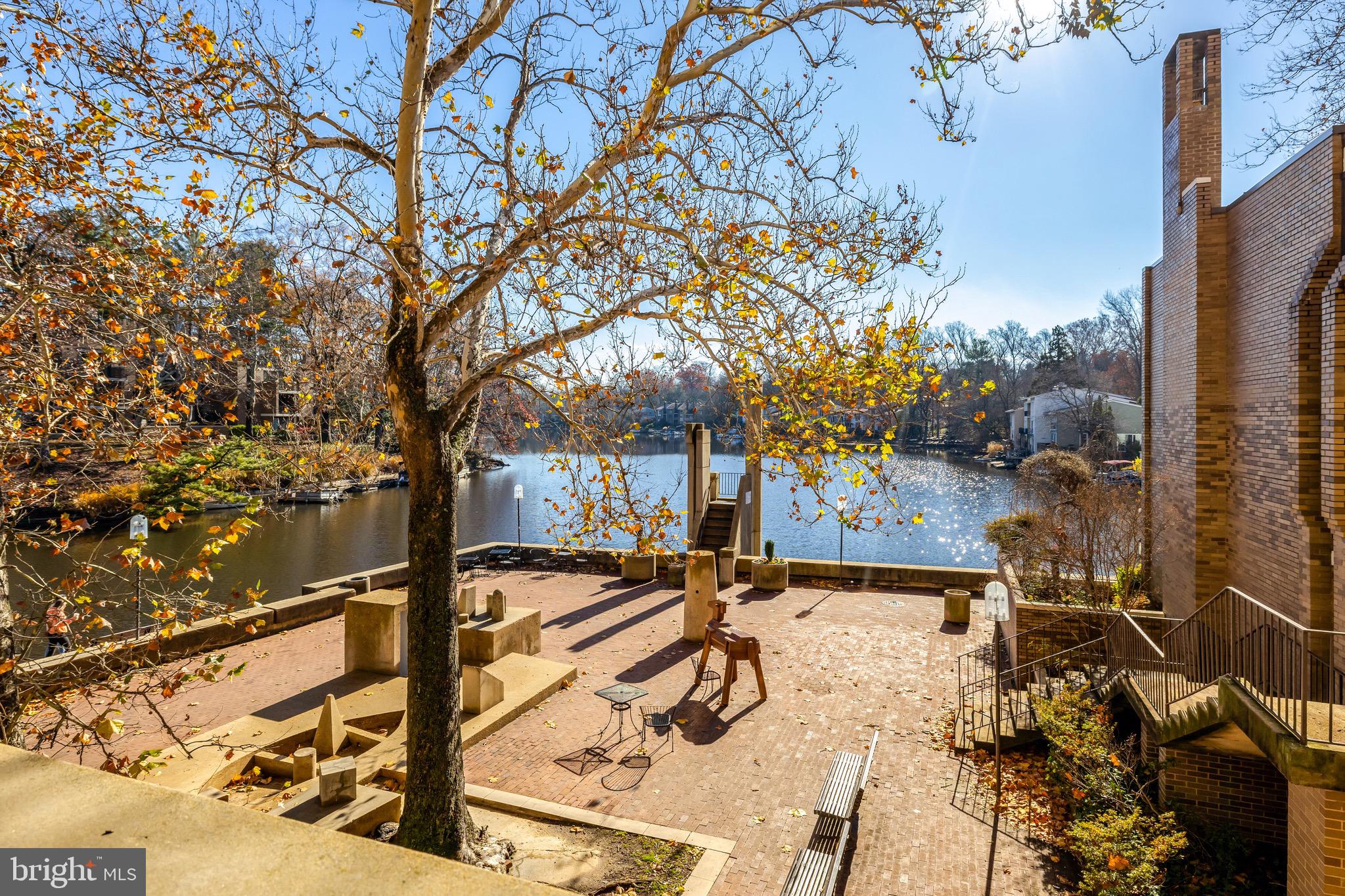 11400 Washington Plaza West, Unit 103 Reston, VA 20190 - Photo 36 of 57 a backyard of a building with large tree