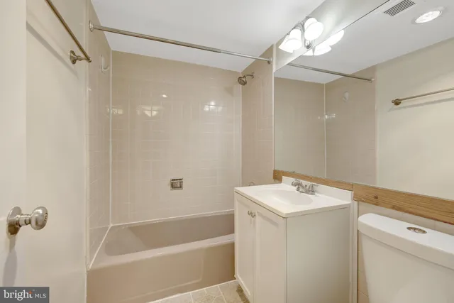 a view of a swimming pool with outdoor seating