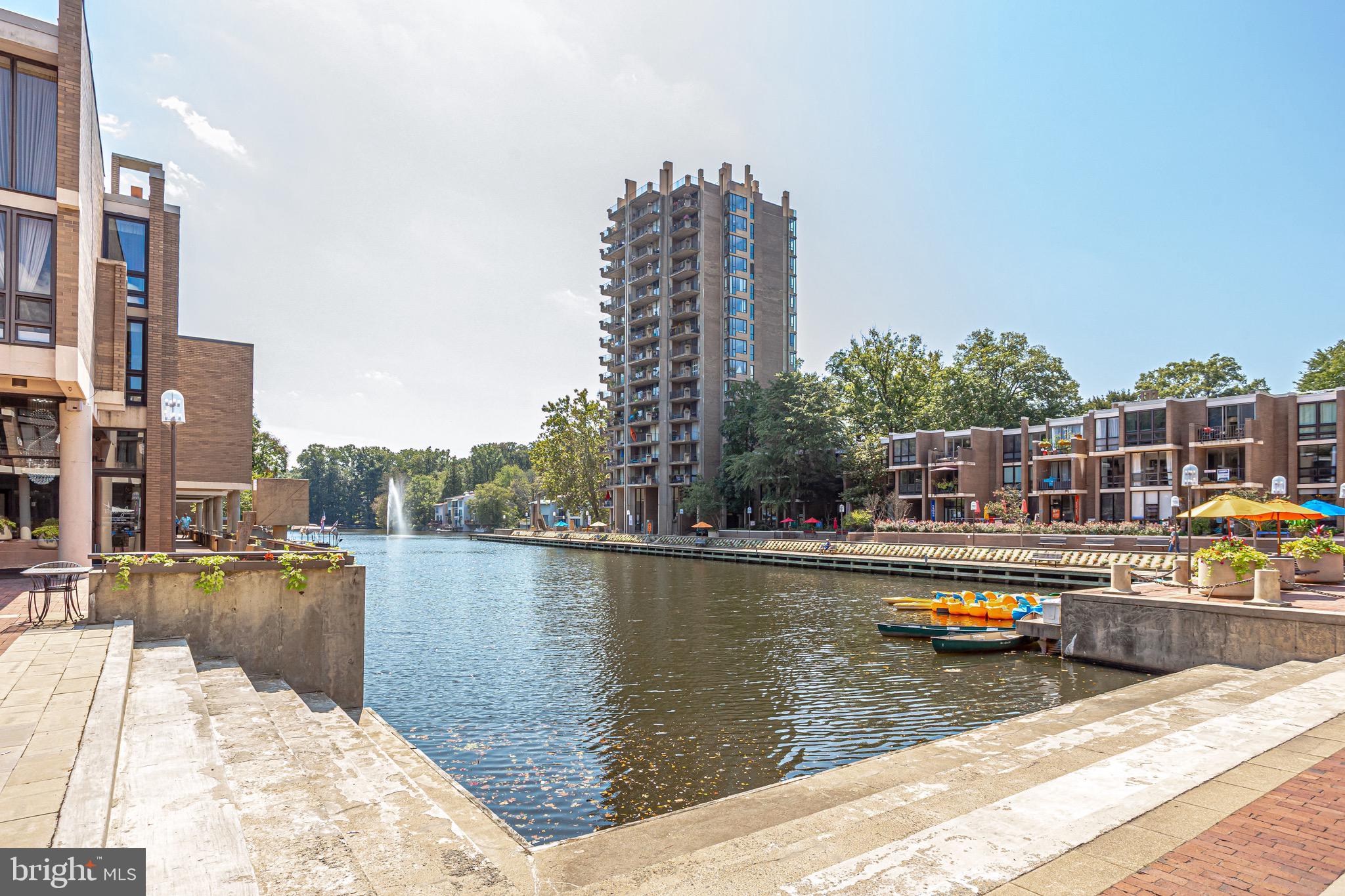 11400 Washington Plaza West, Unit 103 Reston, VA 20190 - Photo 46 of 57 a view of a swimming pool with outdoor seating