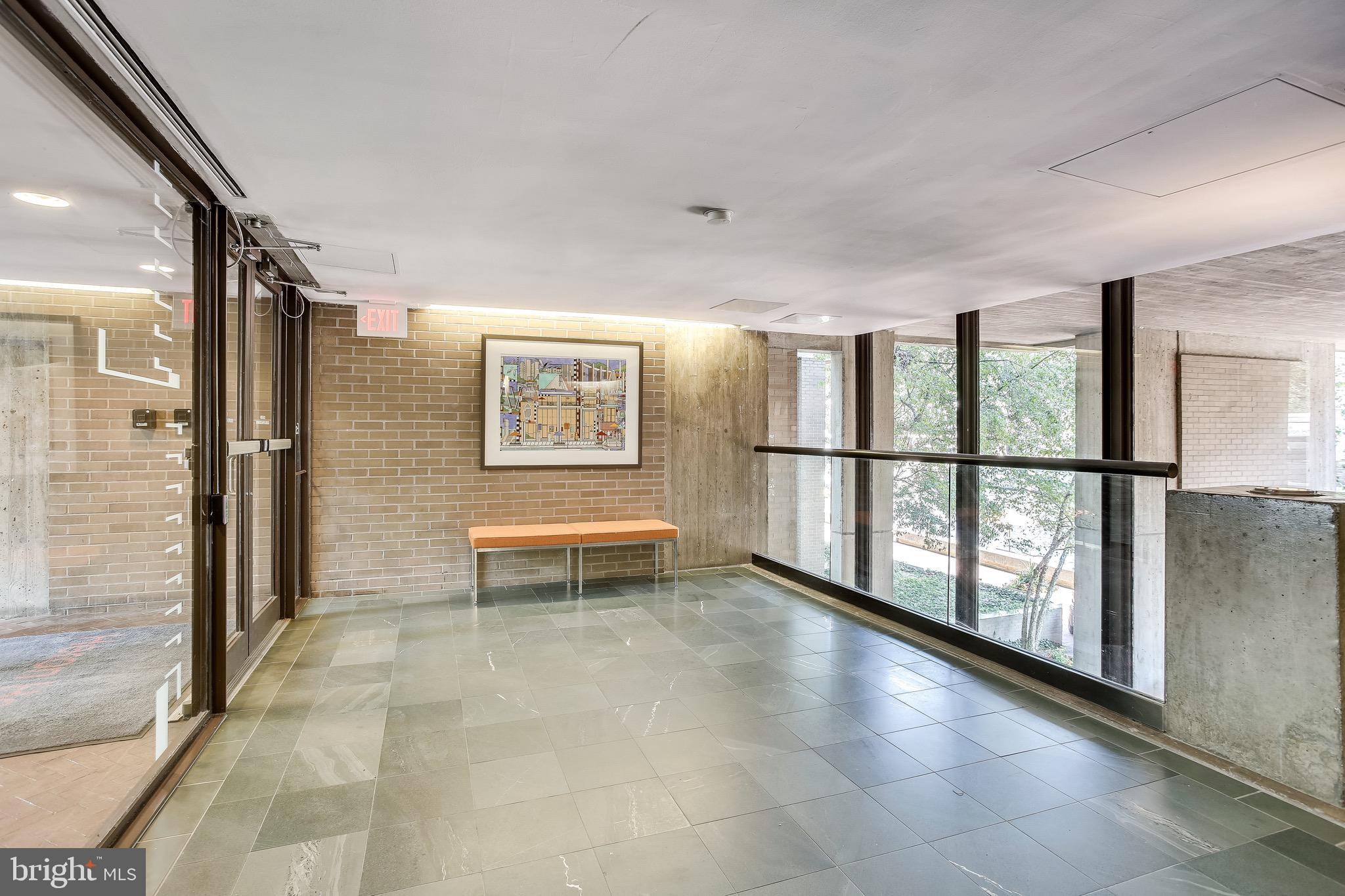 11400 Washington Plaza West, Unit 103 Reston, VA 20190 - Photo 7 of 57 a view of a big room with windows and stairs