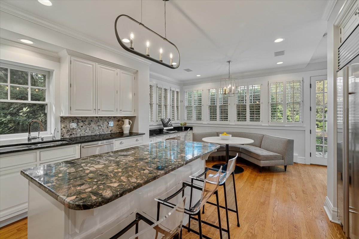 411 Sheridan Road Wilmette, IL 60091 - Photo 13 of 43 a kitchen with granite countertop a stove and white cabinets
