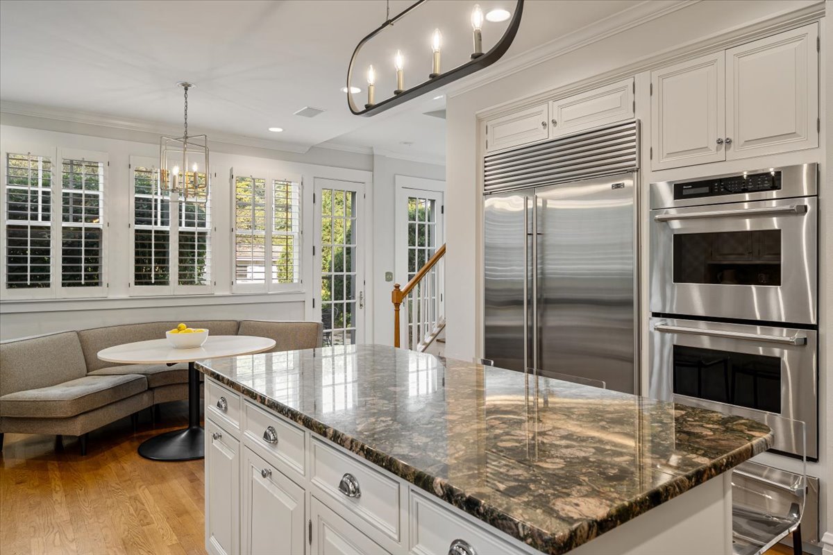 411 Sheridan Road Wilmette, IL 60091 - Photo 14 of 43 a kitchen with stainless steel appliances granite countertop a sink a stove and a refrigerator