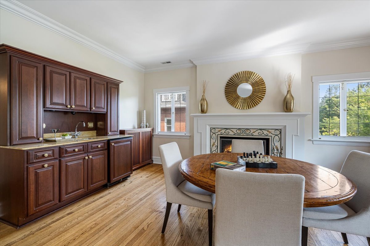 411 Sheridan Road Wilmette, IL 60091 - Photo 23 of 43 a living room with furniture a fireplace and wooden floor