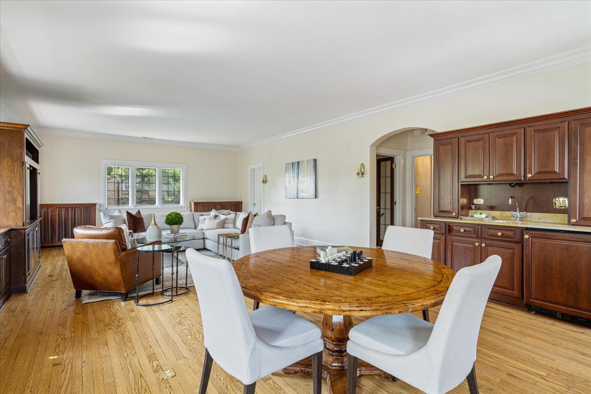 411 Sheridan Road Wilmette, IL 60091 - Photo 24 of 43 a view of a dining room with furniture window and wooden floor