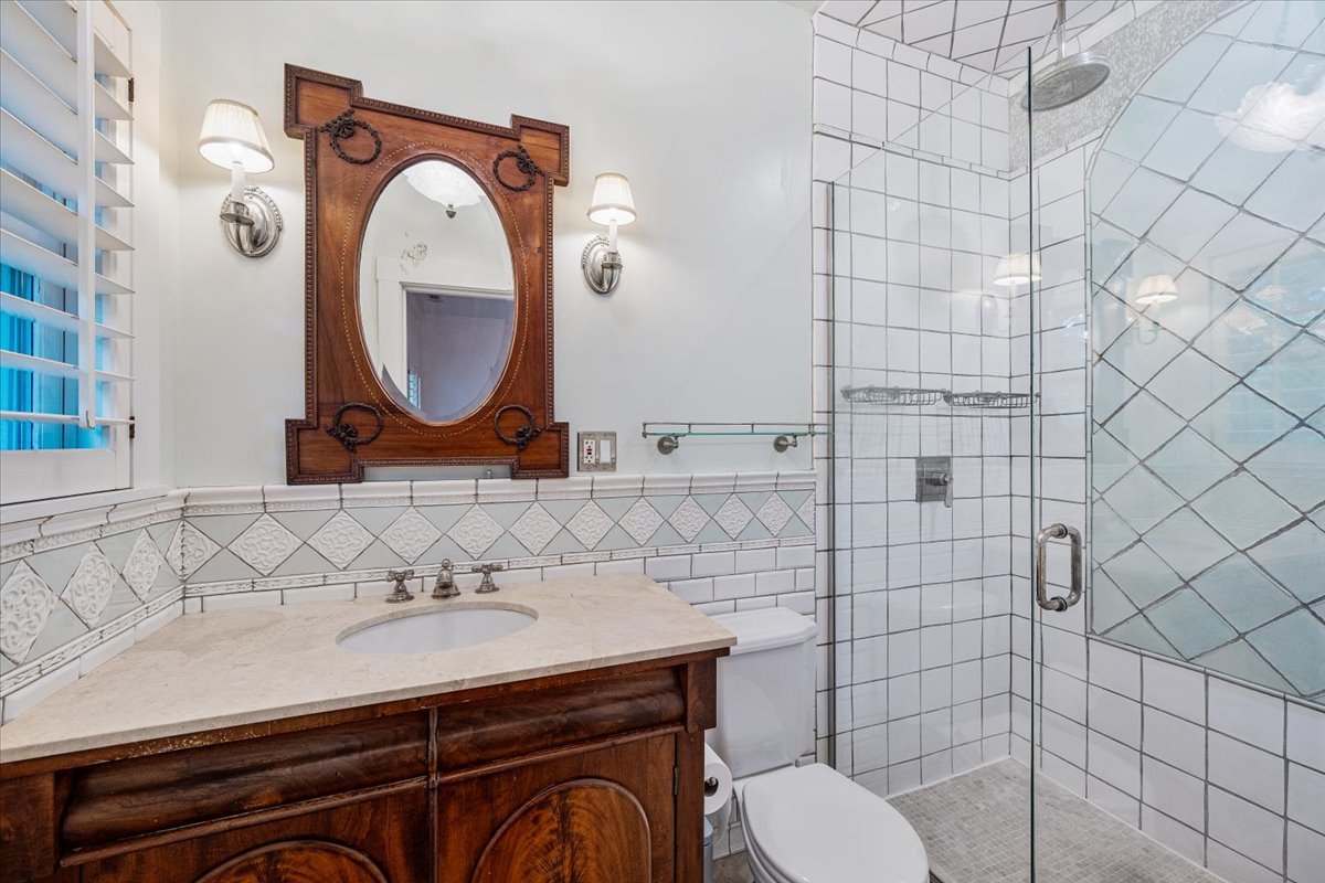 411 Sheridan Road Wilmette, IL 60091 - Photo 26 of 43 a bathroom with a sink mirror vanity and toilet