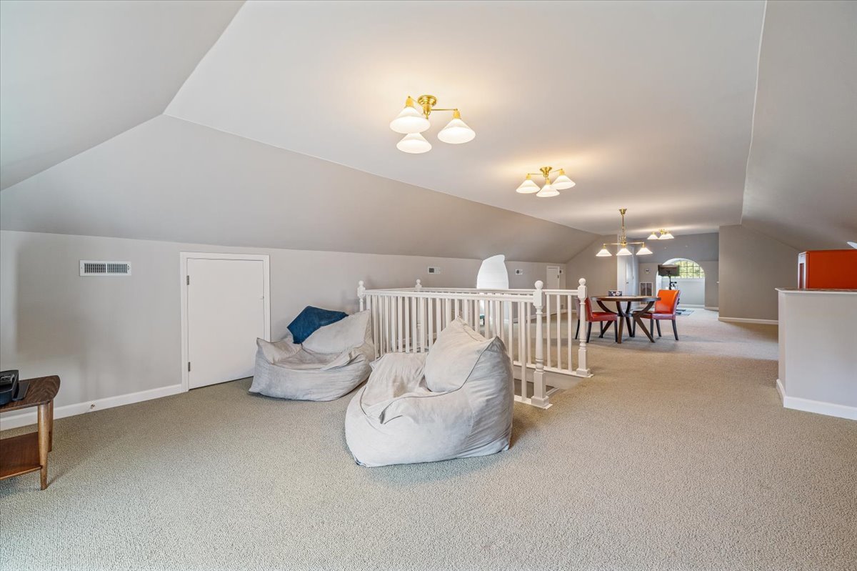 411 Sheridan Road Wilmette, IL 60091 - Photo 35 of 43 a living room with furniture and a chandelier