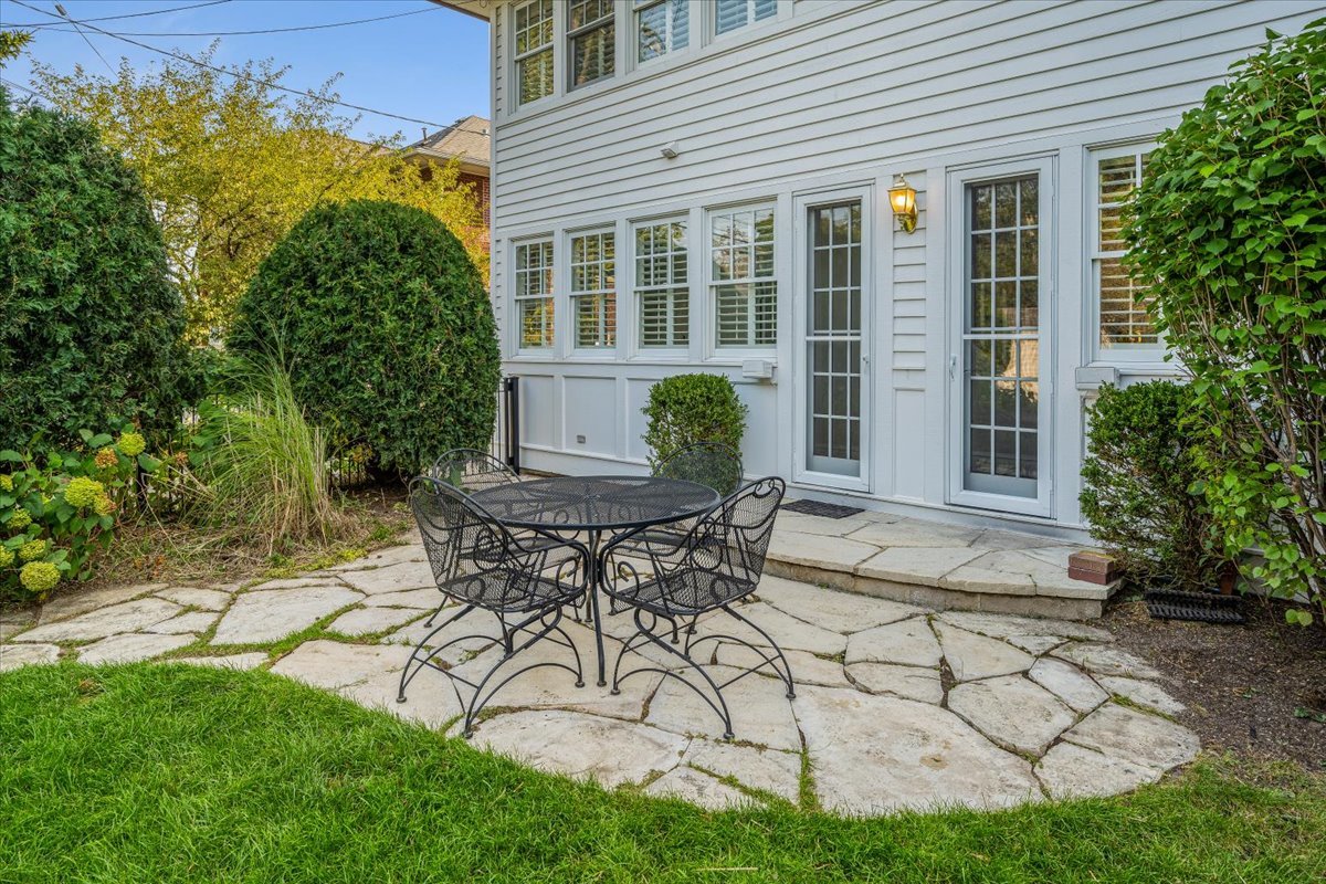 411 Sheridan Road Wilmette, IL 60091 - Photo 38 of 43 a view of a house with backyard and sitting area