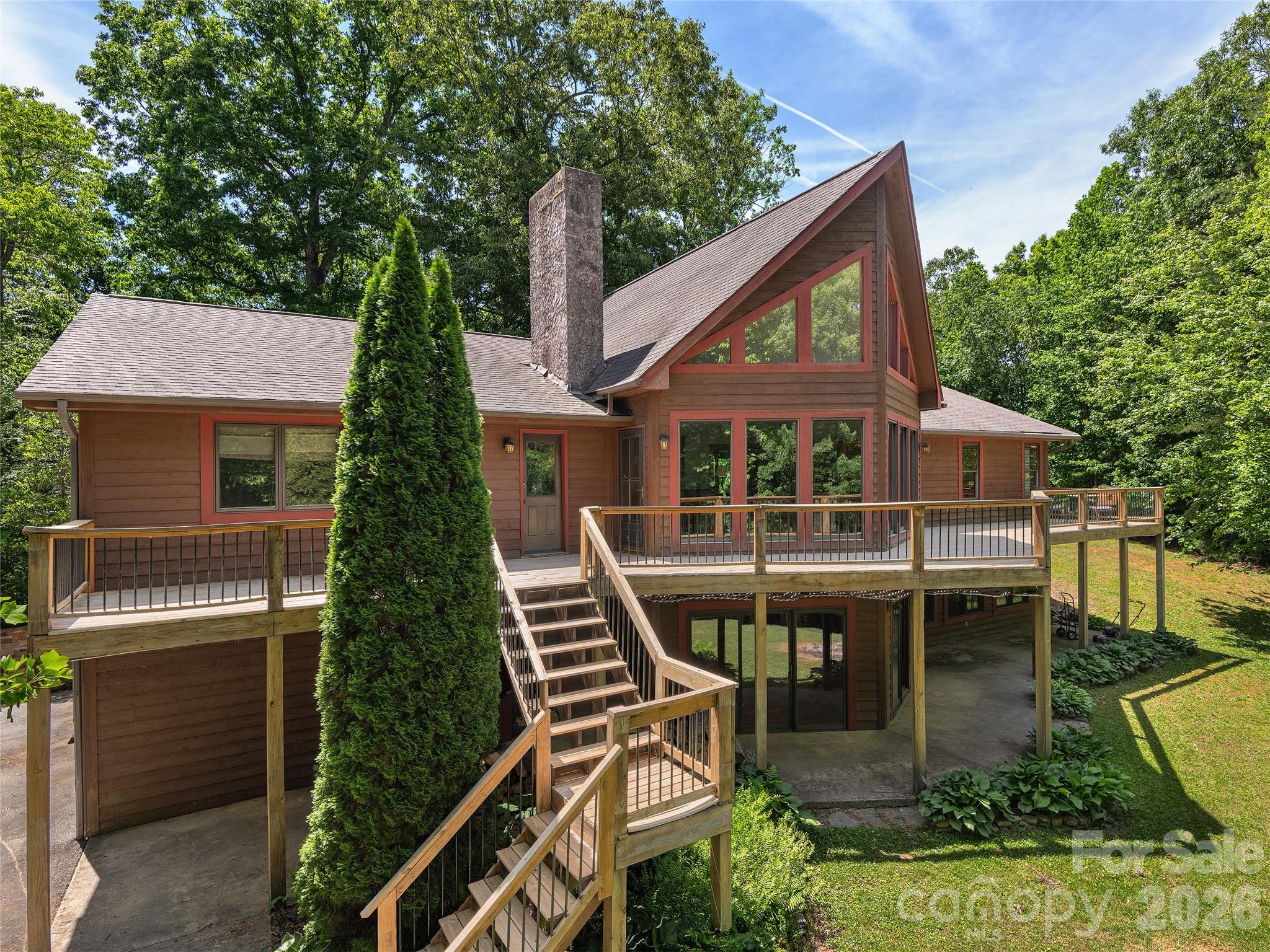 40 Deer Ridge Road Mills River, NC 28759 - Photo 31 of 35 a view of house with a yard and balcony