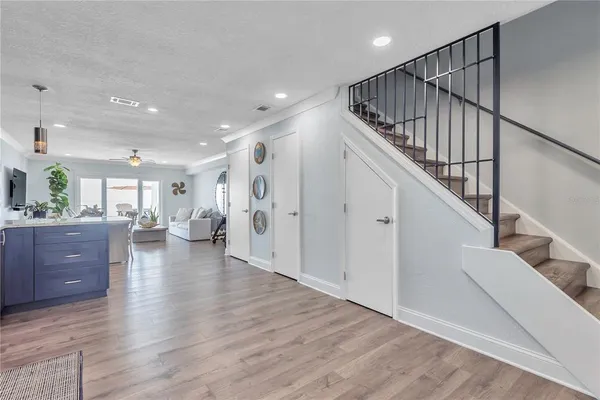 a view of entryway and hall with wooden floor