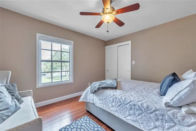 a bedroom with bed and a window