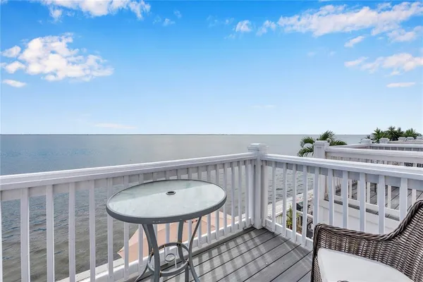 a view of a balcony with furniture
