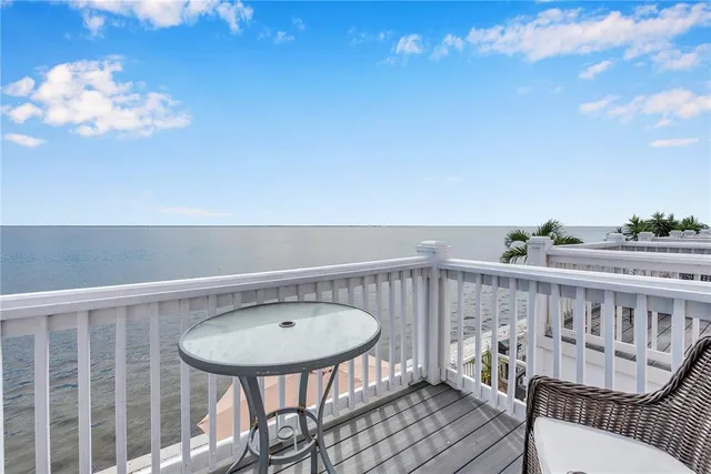 a view of a balcony with furniture