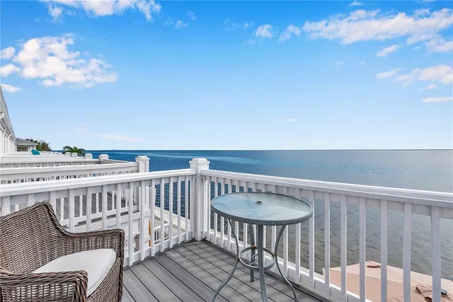 a view of a balcony with furniture