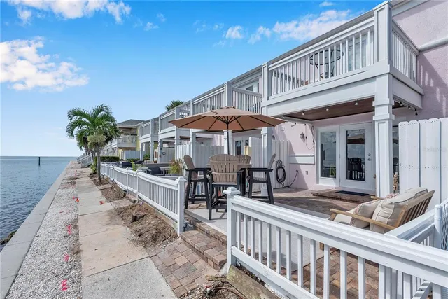 a front view of a building with sitting area