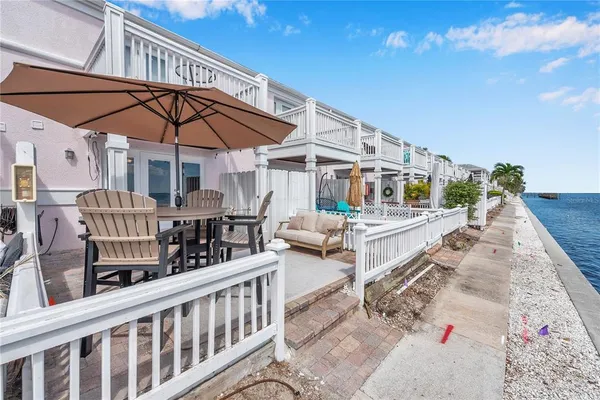 a view of a patio with a table and chairs