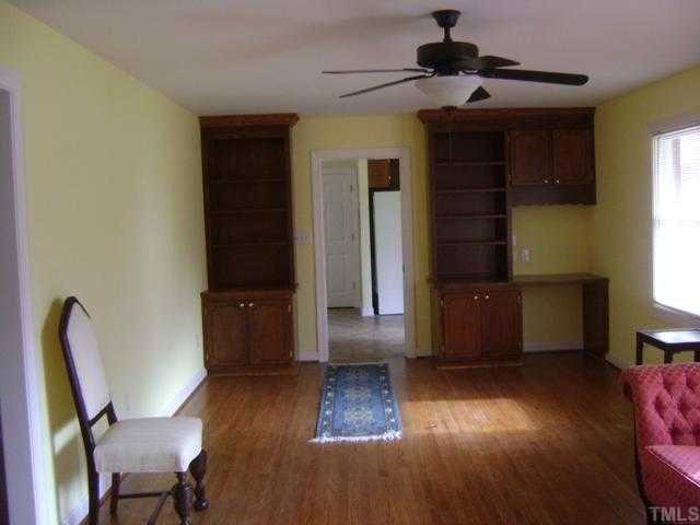 2813 Haven Road, Unit 1 Raleigh, NC 27610 - Photo 2 of 3 a living room with furniture and a wooden floor