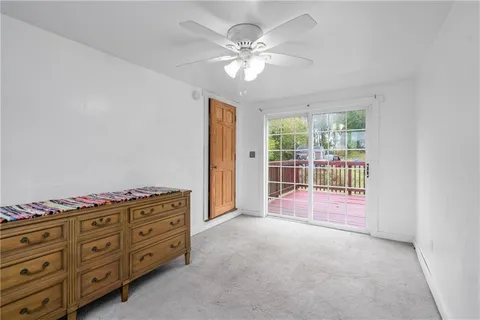 a view of an empty room with a cabinet