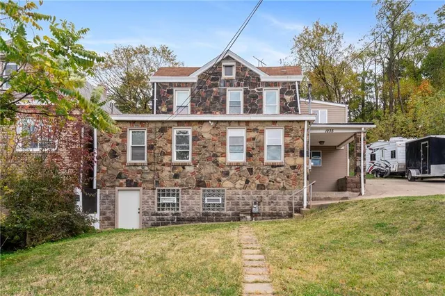 front view of a house with a yard