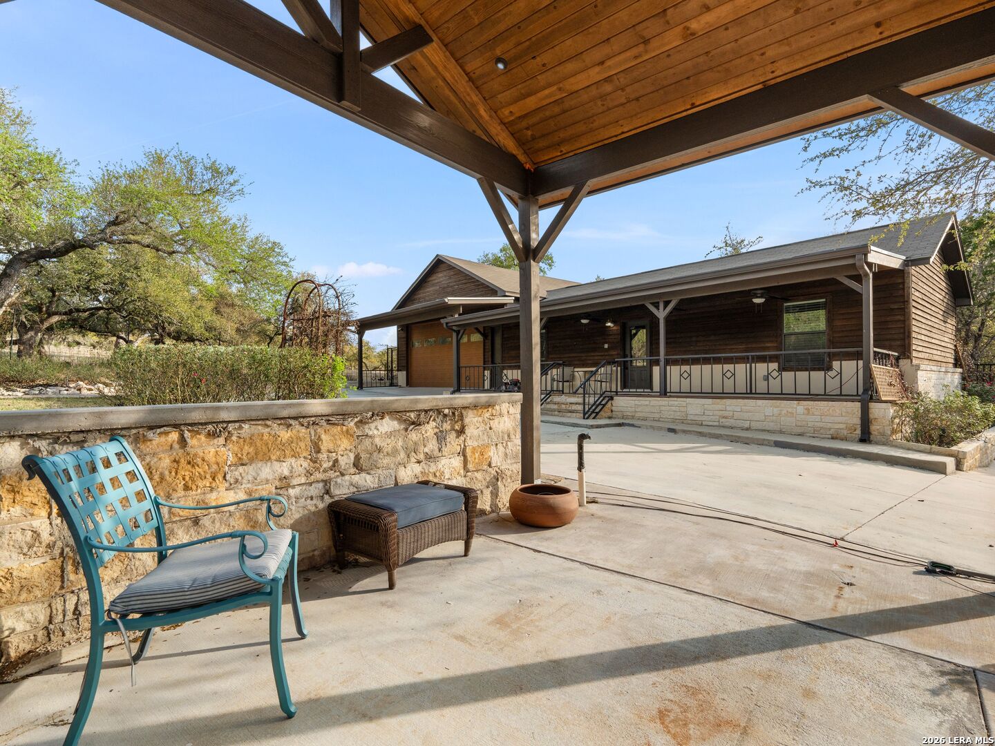 1146 Victoria Avenue Spring Branch, TX 78070 - Photo 87 of 89 a roof deck with table and chairs and potted plants