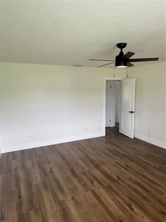 18208 State Road 52 Land O Lakes, FL 34638 - Photo 20 of 44 wooden floor in an empty room