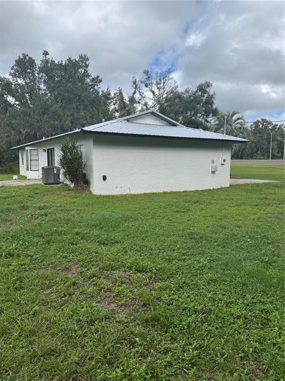 18208 State Road 52 Land O Lakes, FL 34638 - Photo 27 of 44 front view of a house with a yard