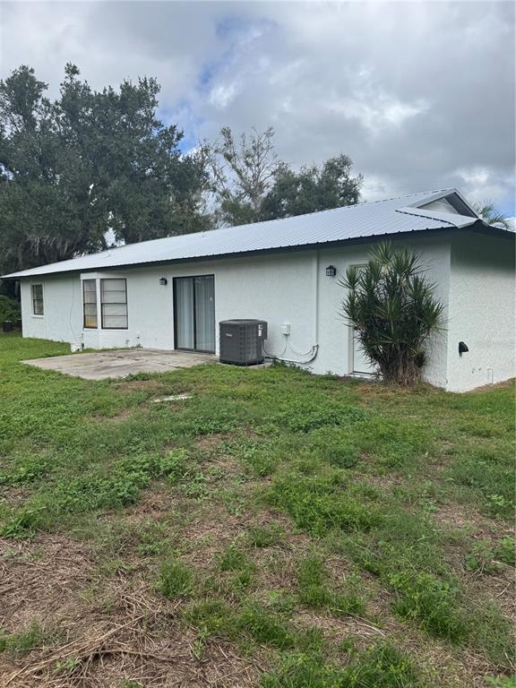 18208 State Road 52 Land O Lakes, FL 34638 - Photo 31 of 44 a backyard of a house with lots of green space