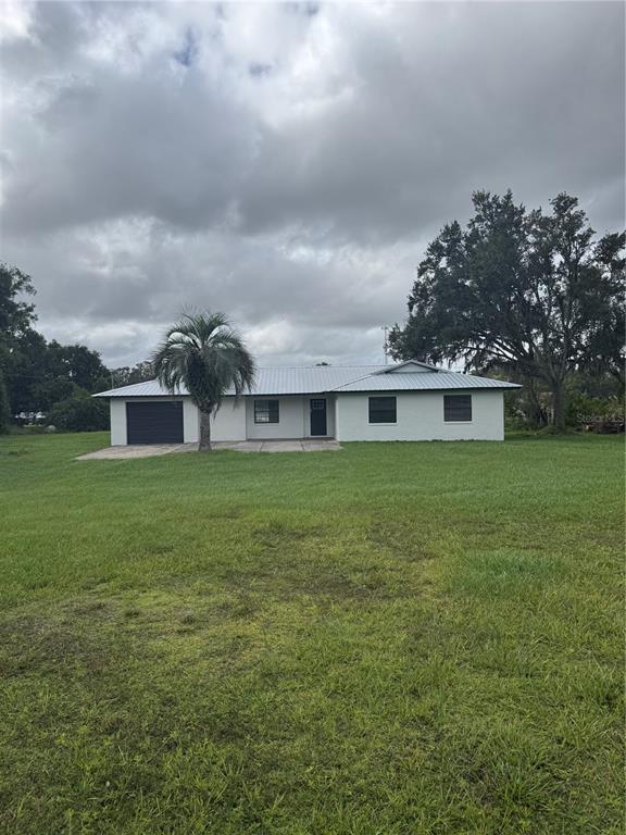 18208 State Road 52 Land O Lakes, FL 34638 - Photo 42 of 44 a view of house with a big yard