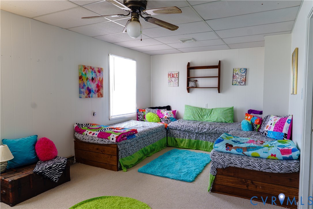 1280 Little Florida Road Farnham, VA 22460 - Photo 22 of 41 Carpeted room with a drop ceiling and white vertic