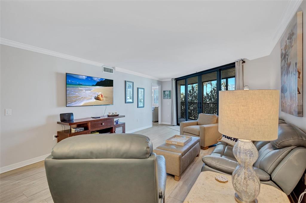 5880 Midnight Pass Road, Unit 306 Sarasota, FL 34242 - Photo 26 of 71 a living room with furniture and a window