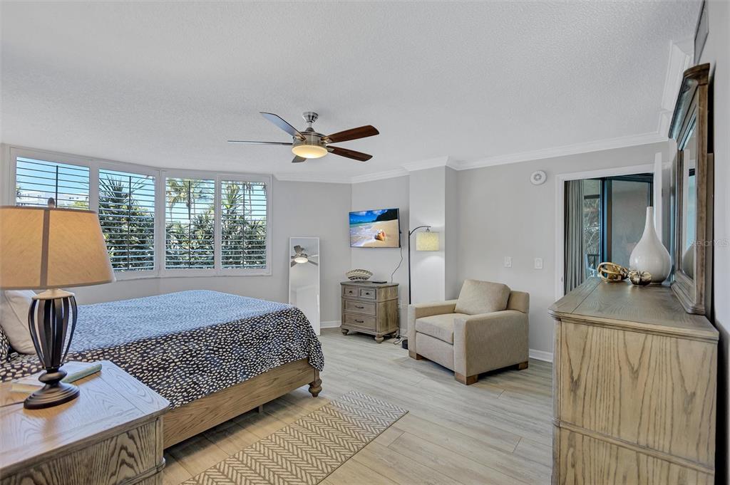 5880 Midnight Pass Road, Unit 306 Sarasota, FL 34242 - Photo 32 of 71 a bedroom with furniture and a window