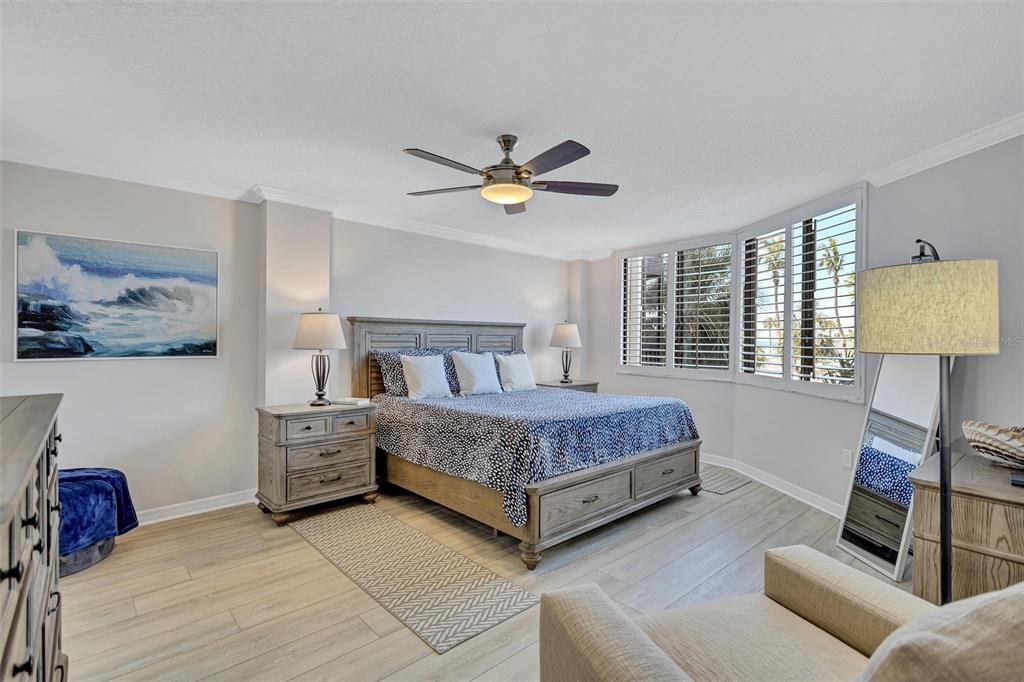 5880 Midnight Pass Road, Unit 306 Sarasota, FL 34242 - Photo 35 of 71 a bedroom with a bed couch and a window